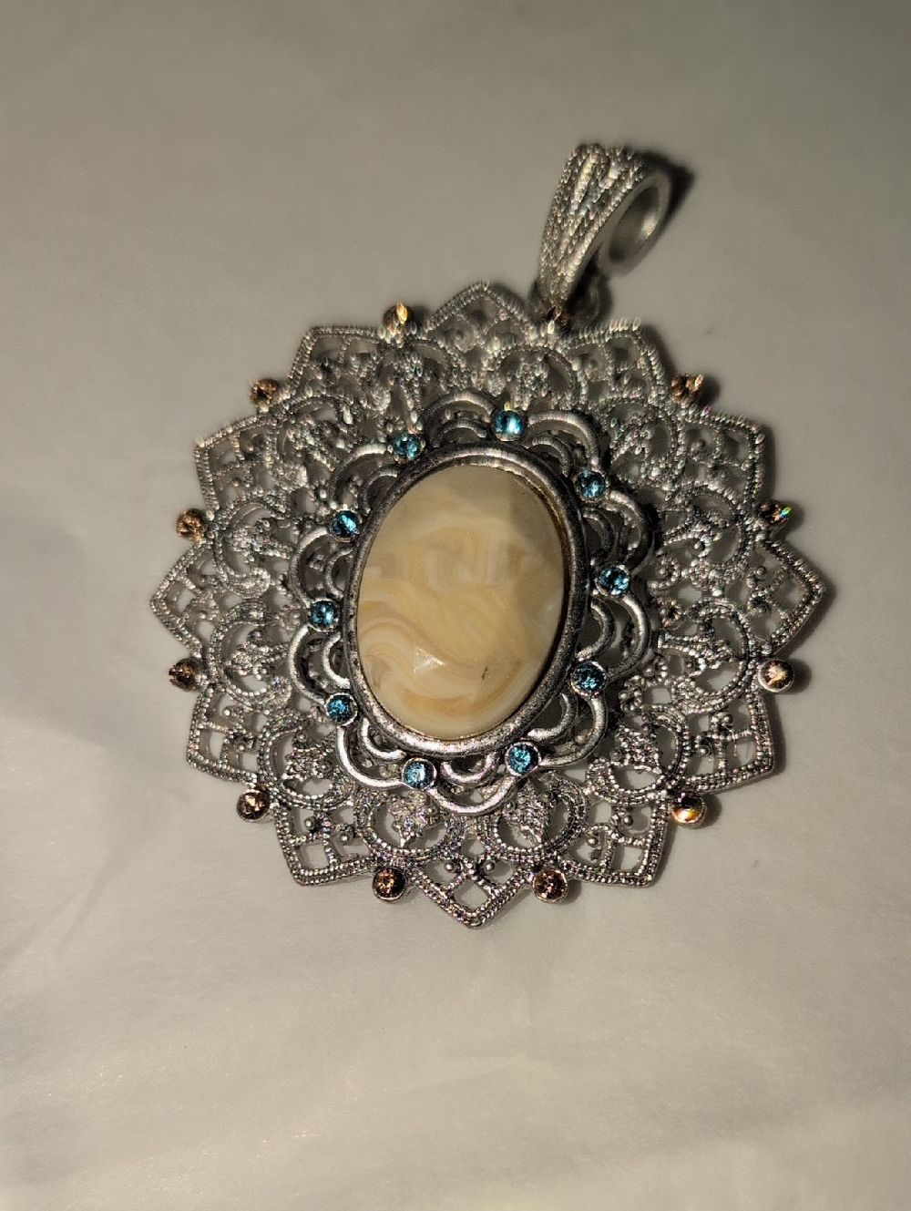 🥀3/$25🥀 Intricate Silver-Tone Faux Floral Pendant with Cream and Blue Accents